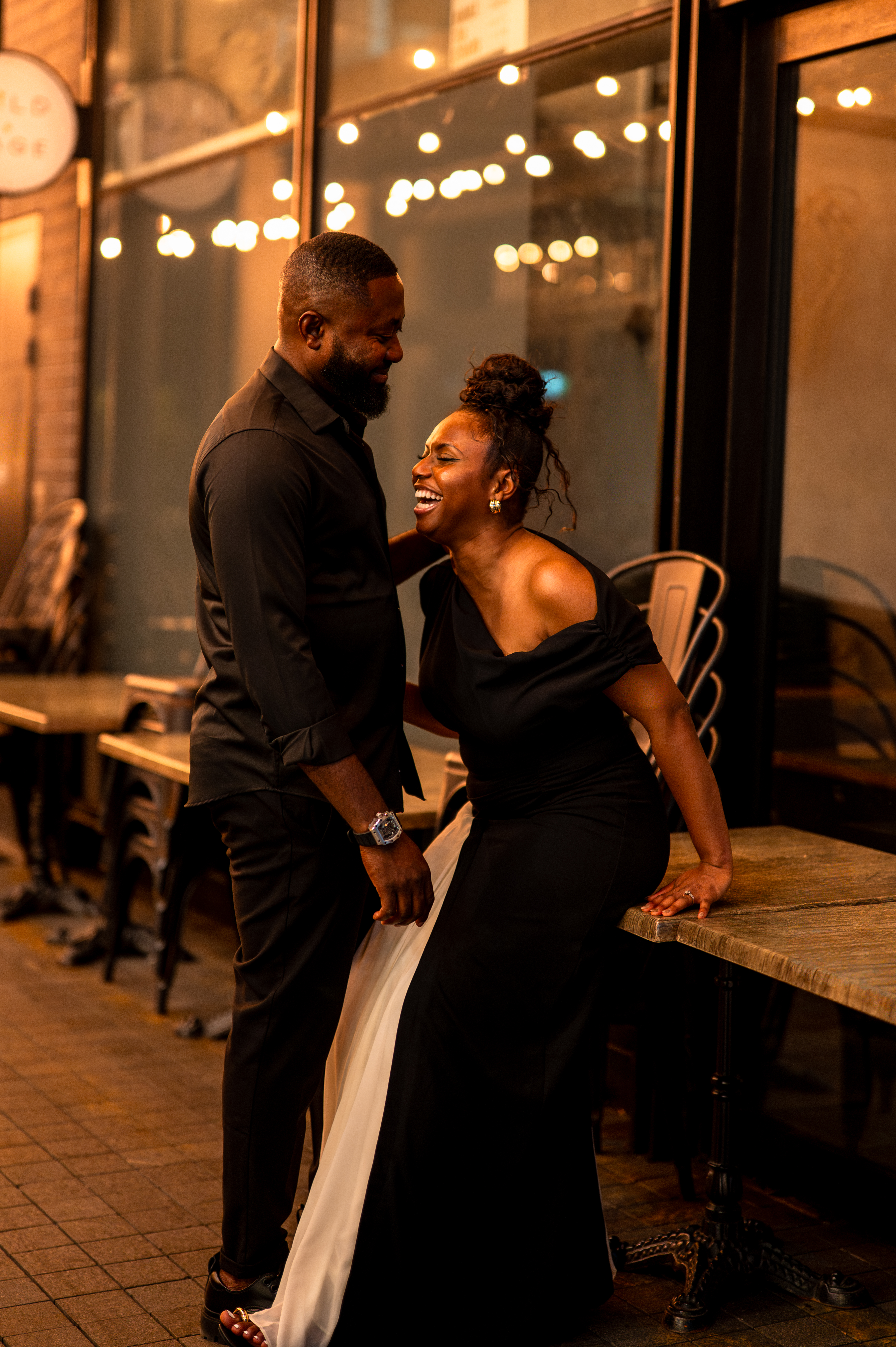 Engagement session — couple laughing together outdoors